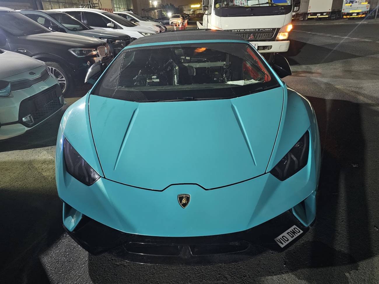 A teal Lamborghini in the Al Baidar workshop
